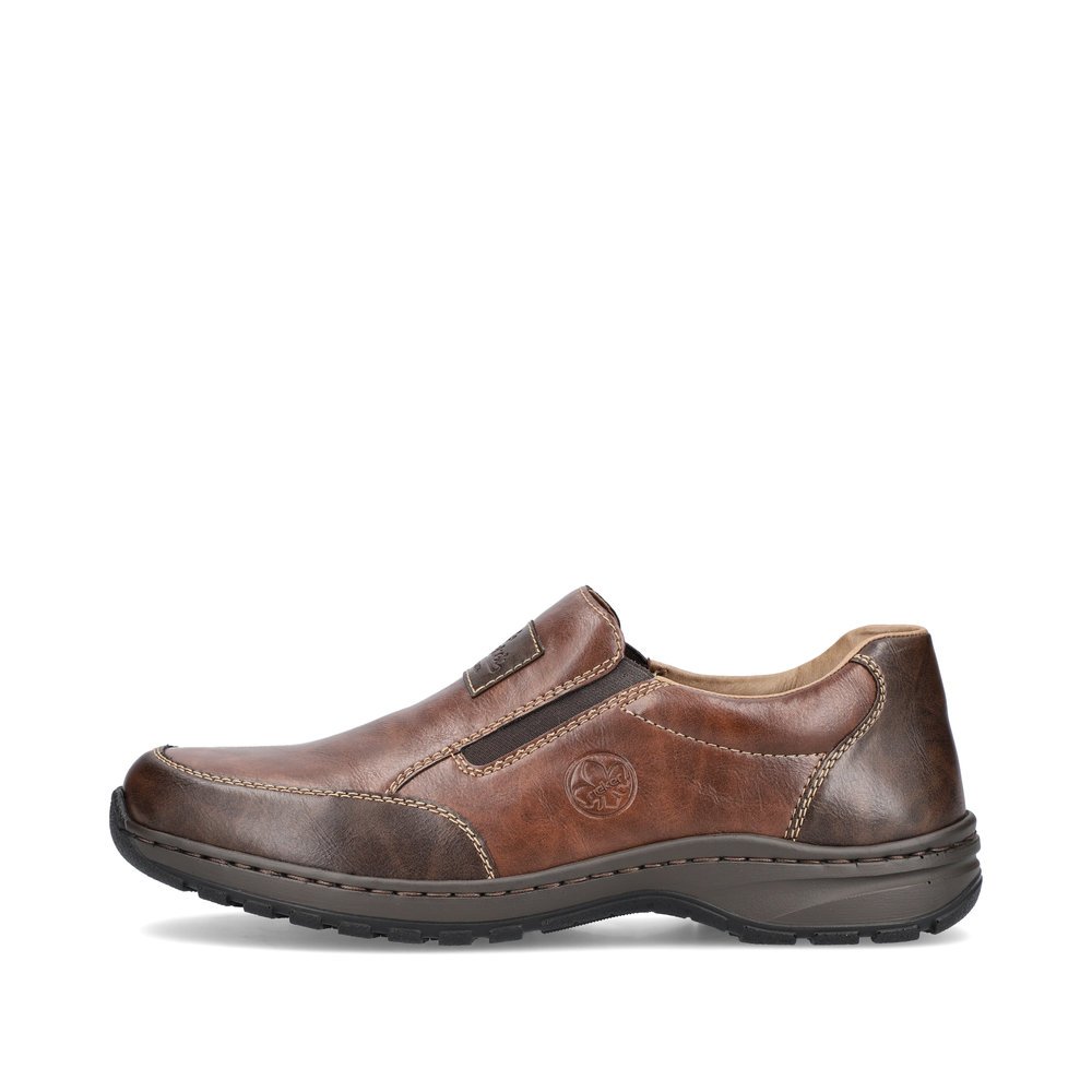 Brown Rieker men´s slippers 03354-26 with elastic insert as well as extra width H. Outside of the shoe.