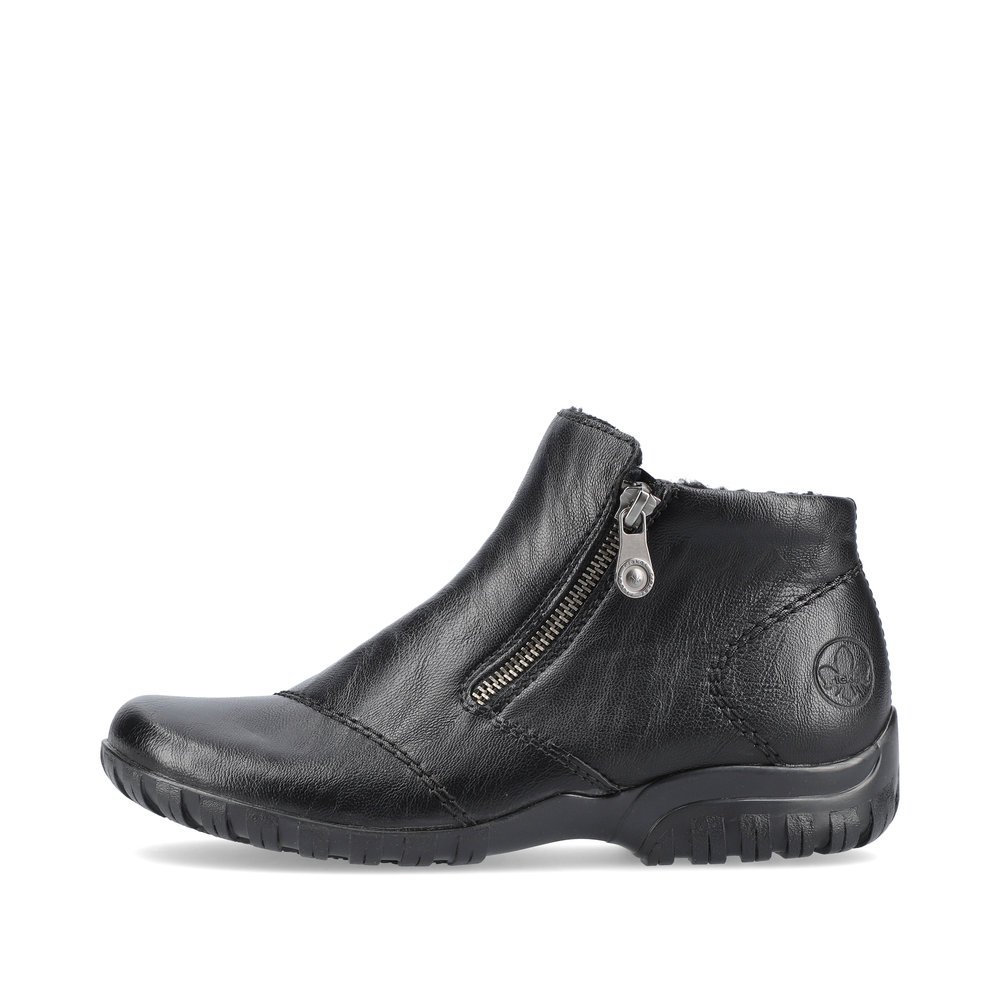 Night black Rieker women´s slippers L4663-01 with a zipper as well as profile sole. The outside of the shoe