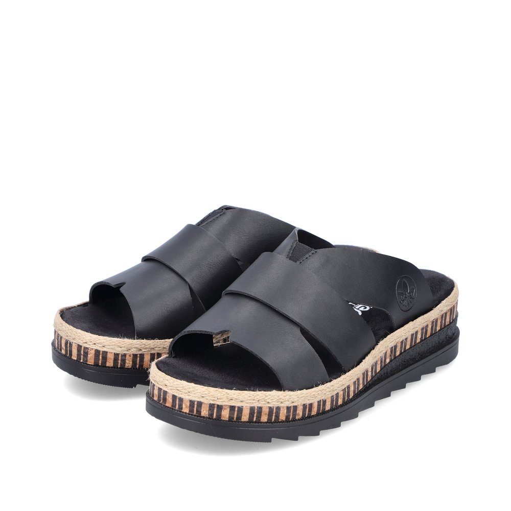 Black Rieker women´s mules V7989-00 with stripe pattern as well as slim fit E 1/2. Shoes laterally.