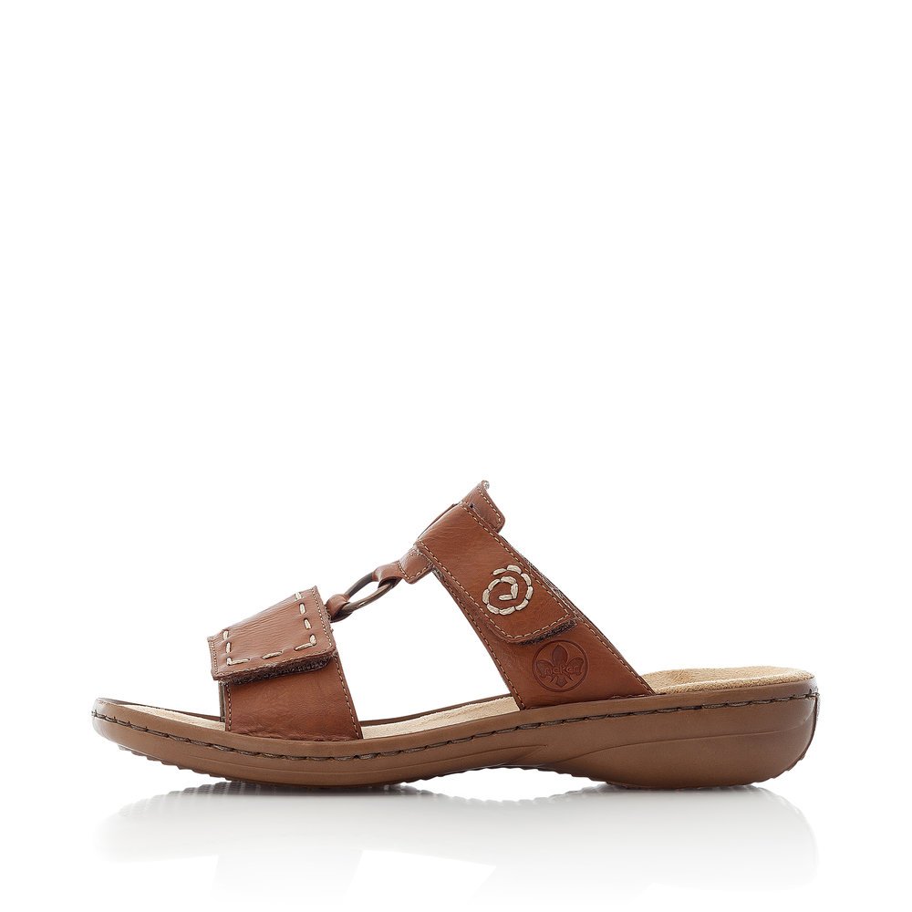 Coffee brown Rieker women´s mules 60822-24 with a hook and loop fastener. Outside of the shoe.