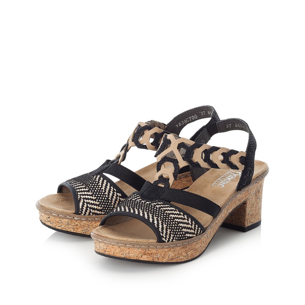 Jet black Rieker women´s strap sandals 638C7-00 with an elastic insert. Shoes laterally.
