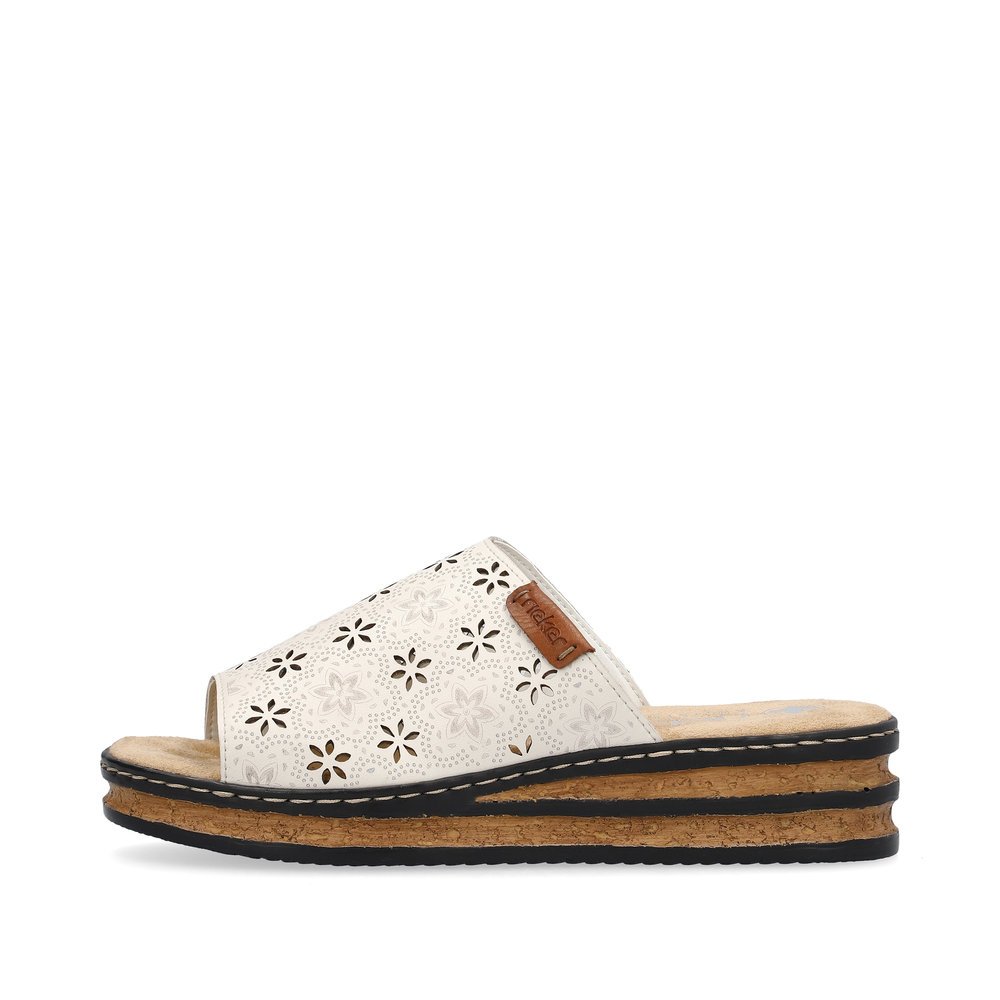 Beige Rieker women´s mules 62955-60 in perforated look as well as slim fit E 1/2. Outside of the shoe.