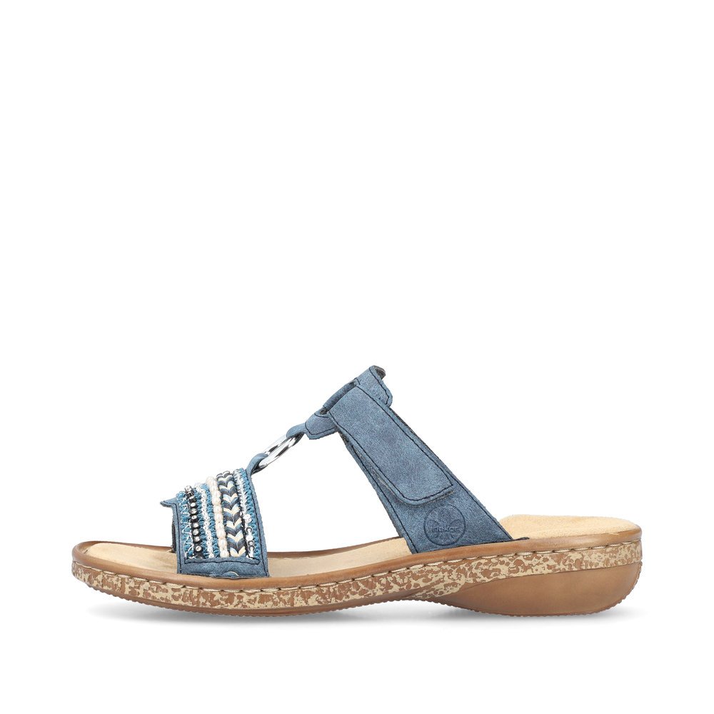 Denim blue Rieker women´s mules 628M6-14 with a hook and loop fastener. Outside of the shoe.