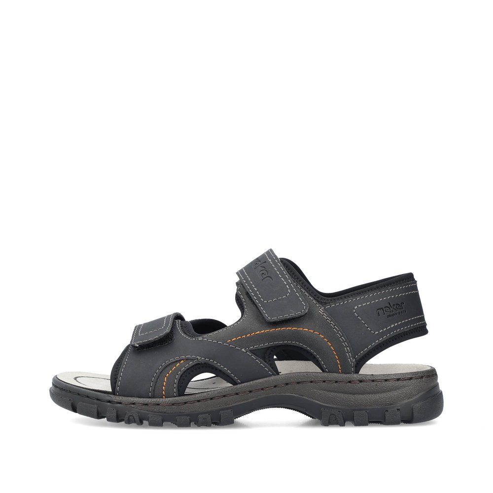 Black Rieker men´s hiking sandals 25053-00 with a hook and loop fastener. Outside of the shoe.