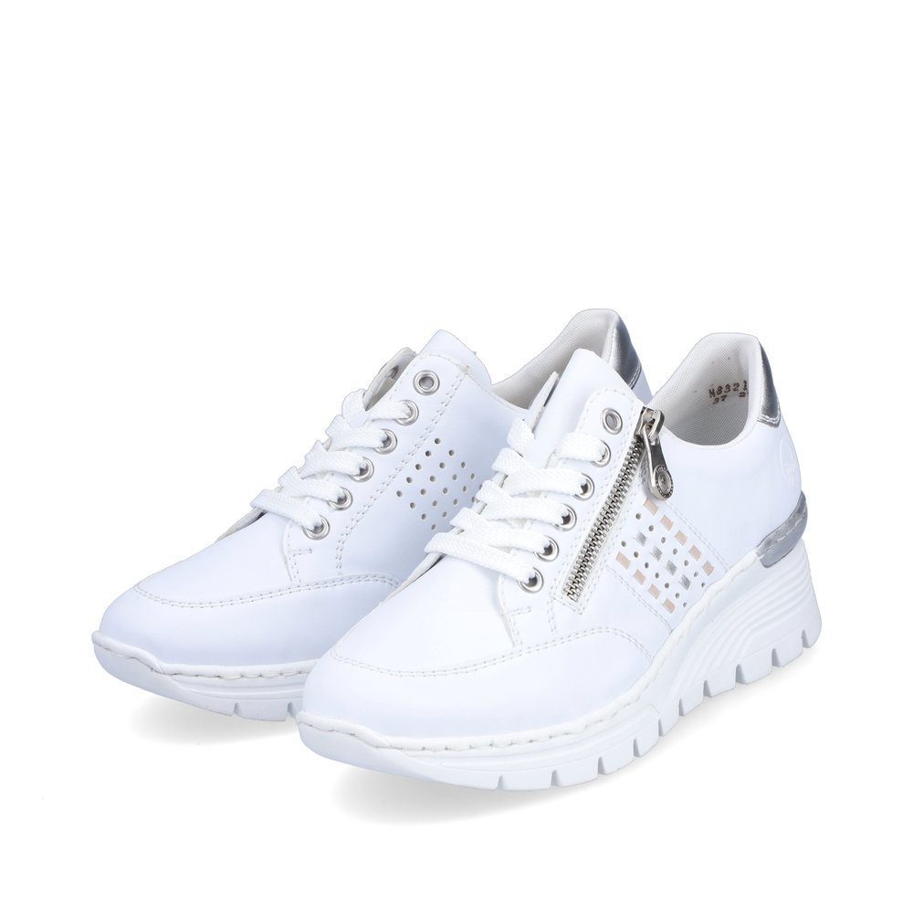 Pure white Rieker women´s low-top sneakers N8321-80 with a zipper. Shoes laterally.