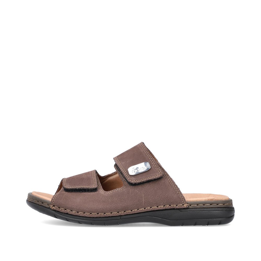 Coffee brown Rieker men´s mules 25590-25 with a hook and loop fastener. Outside of the shoe.