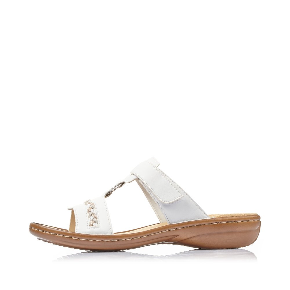 White Rieker women´s mules 60888-80 with a hook and loop fastener. Outside of the shoe.