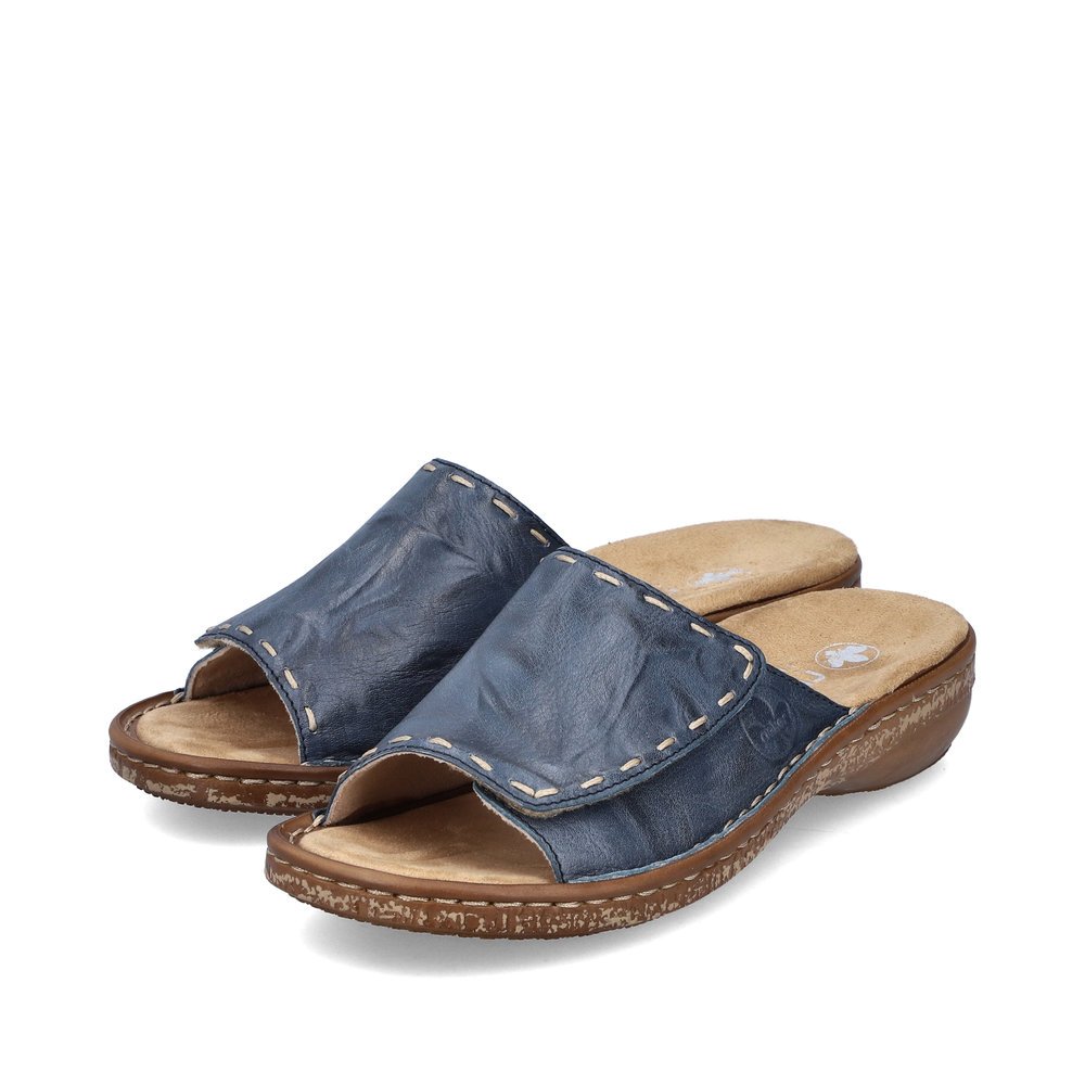 Slate blue Rieker women´s mules 62890-14 with a hook and loop fastener. Shoes laterally.