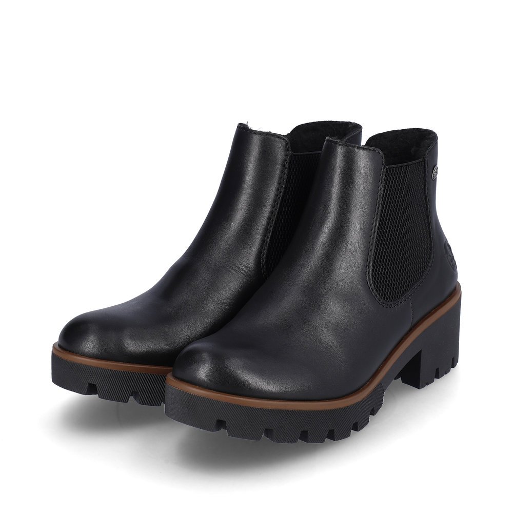 Night black Rieker women´s Chelsea boots 79265-02 with profile sole with block heel. Shoe laterally