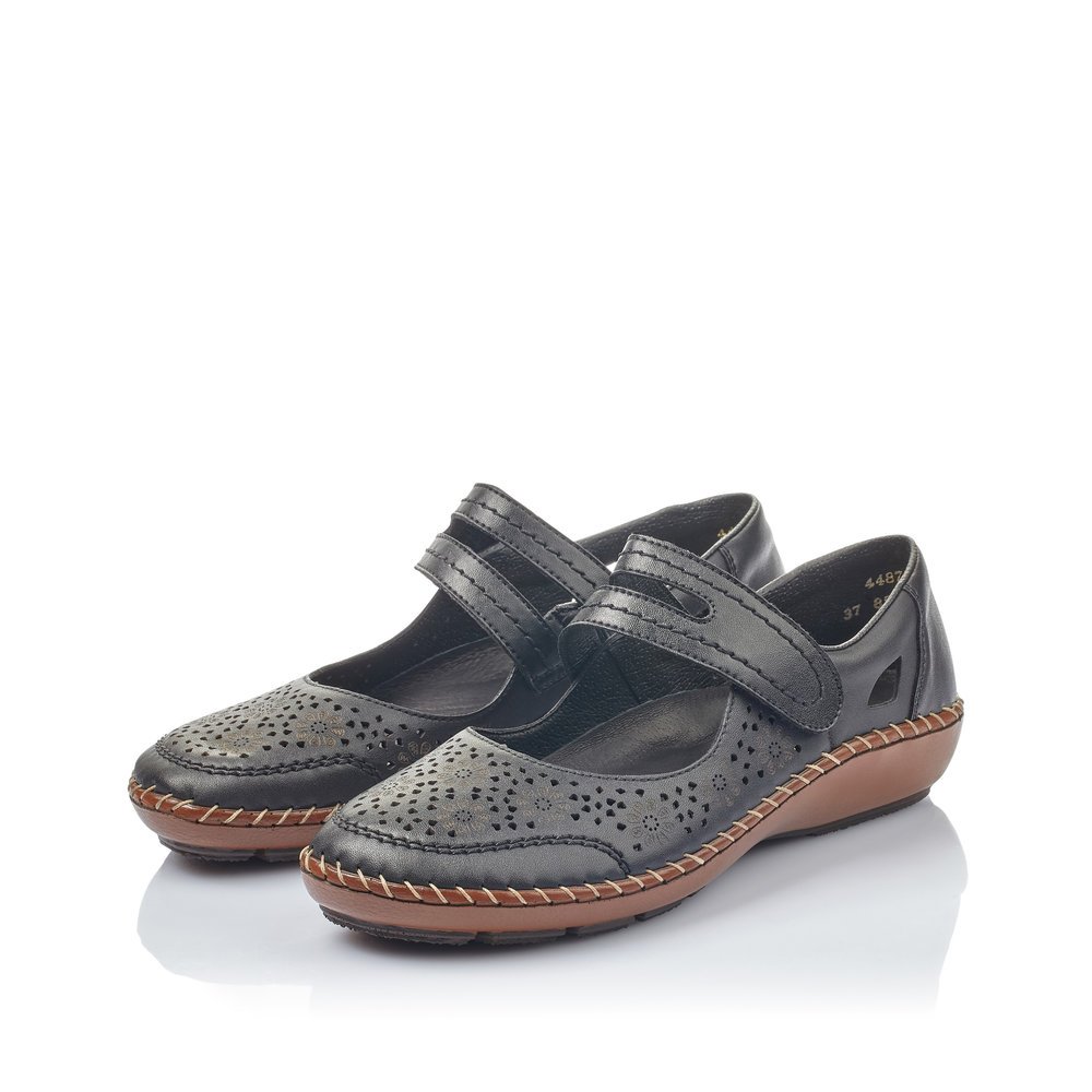 Night black Rieker women´s ballerinas 44875-00 with a hook and loop fastener. Shoes laterally.