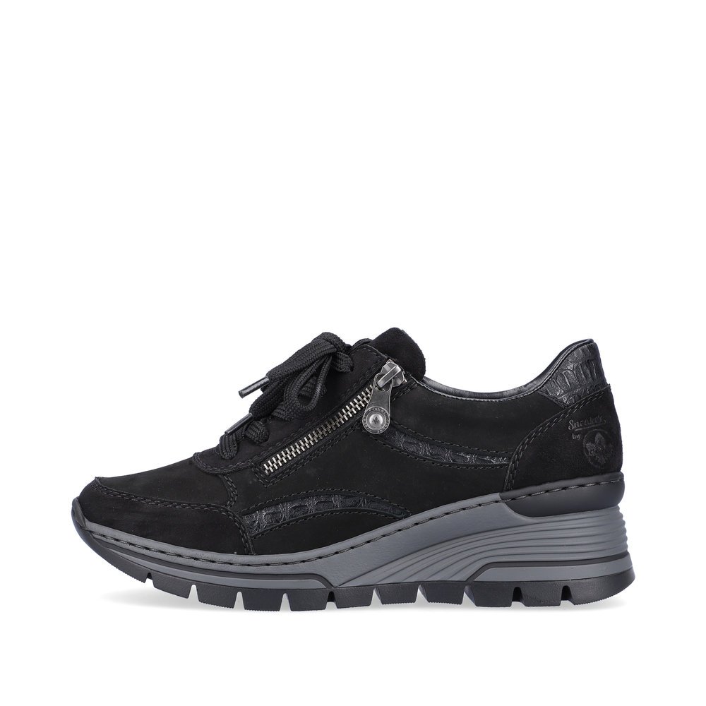 Jet black Rieker women´s sneakers N8306-00 with shock-absorbing sole with wedge heel. The outside of the shoe