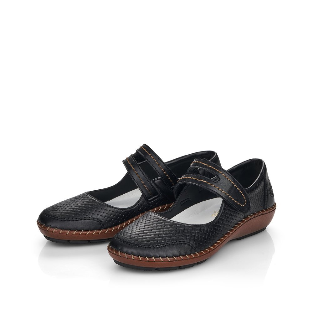Midnight black Rieker women´s ballerinas 44871-00 with a hook and loop fastener. Shoes laterally.