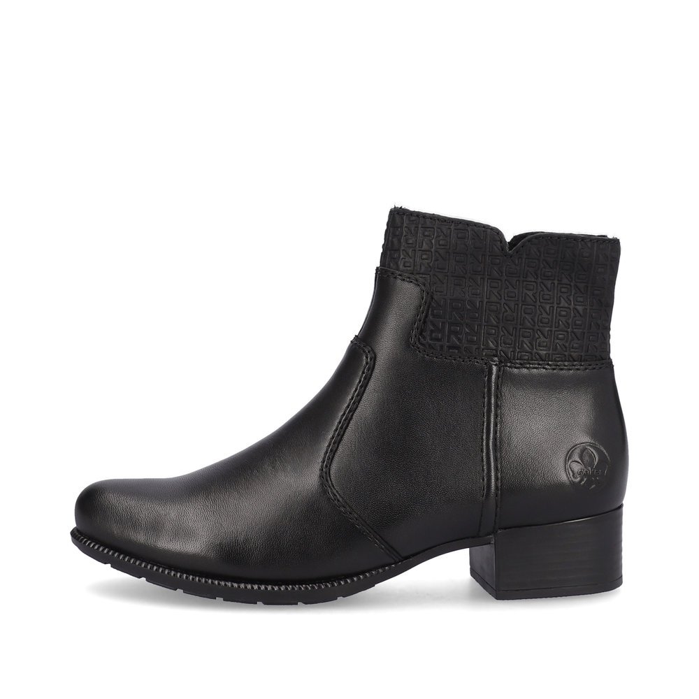 Midnight black Rieker women´s ankle boots 78653-00 with profile sole with block heel. The outside of the shoe