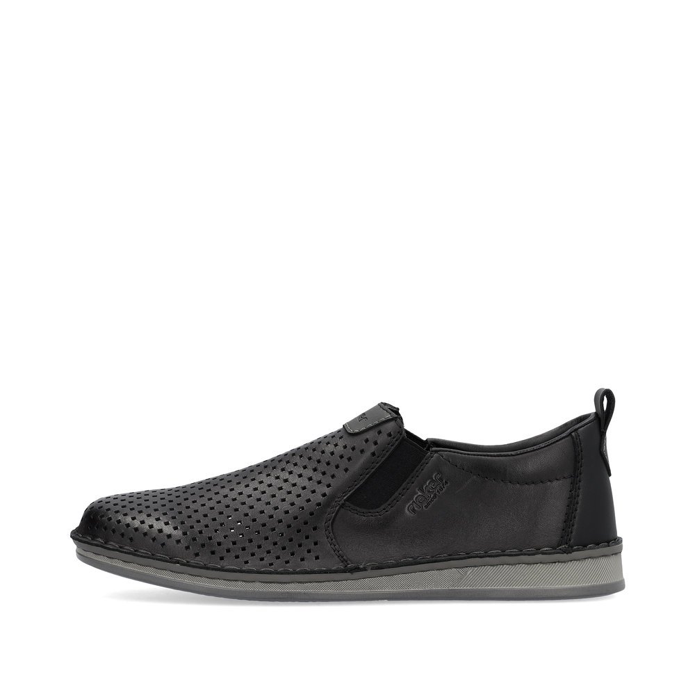 Black Rieker men´s slippers 05457-00 with elastic insert as well as perforated look. Outside of the shoe.