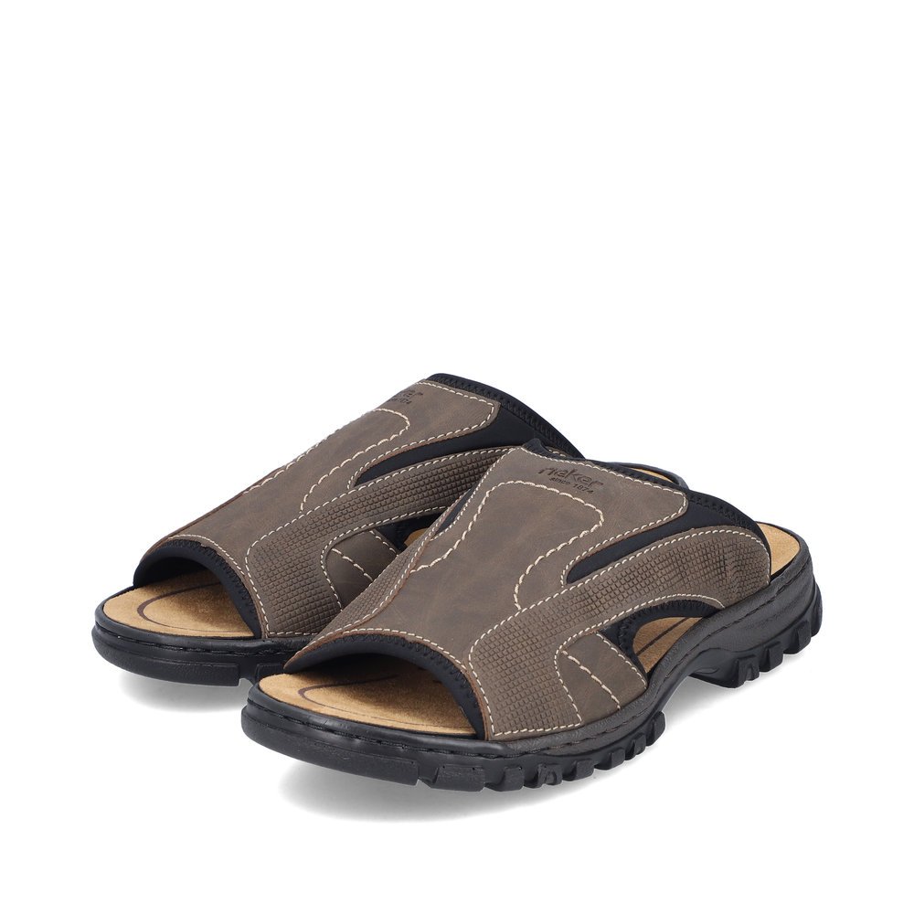 Brown-grey Rieker men´s mules 25093-25 with an elastic insert. Shoes laterally.
