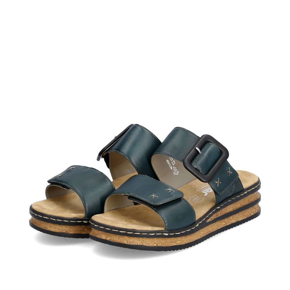 Steel blue Rieker women´s mules 62954-12 with a hook and loop fastener. Shoes laterally.