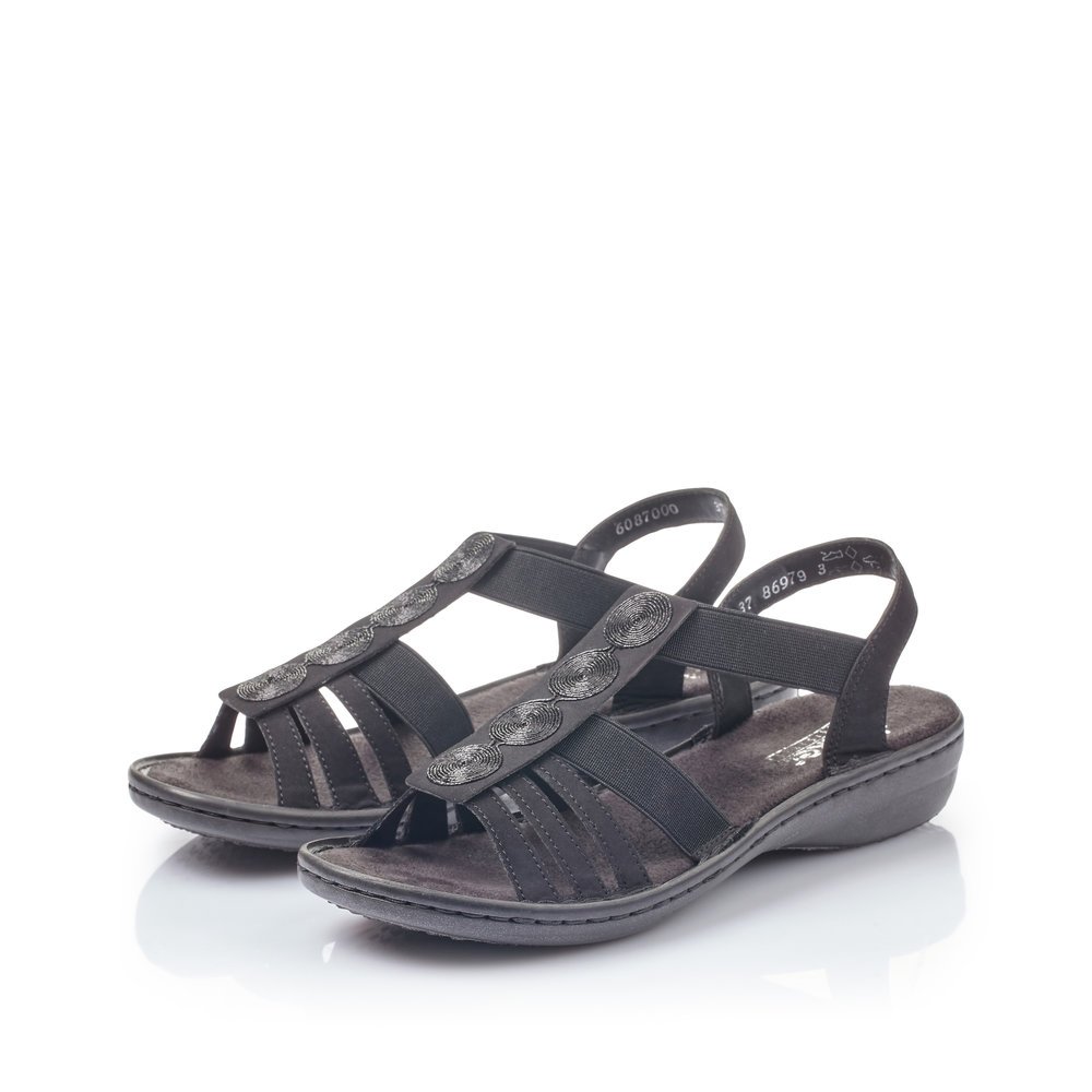 Jet black Rieker women´s strap sandals 60870-00 with an elastic insert. Shoes laterally.