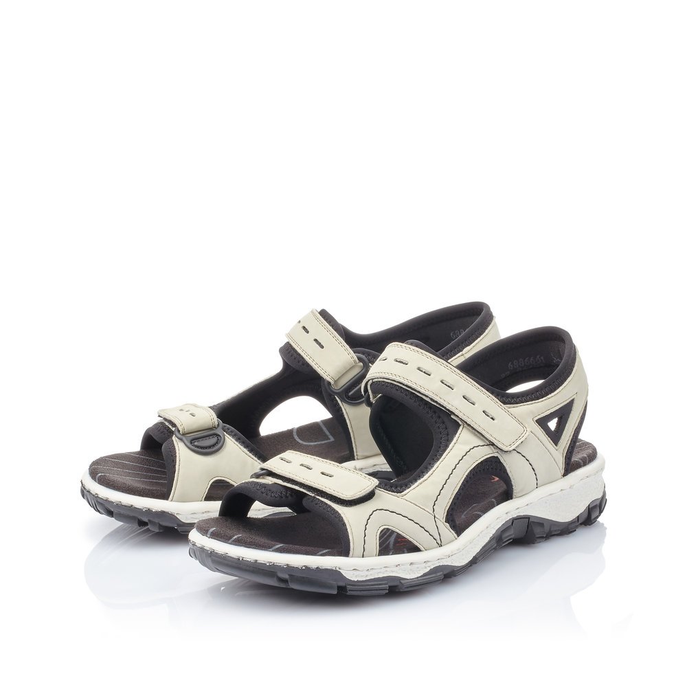 Cream beige Rieker women´s hiking sandals 68866-61 with a hook and loop fastener. Shoes laterally.