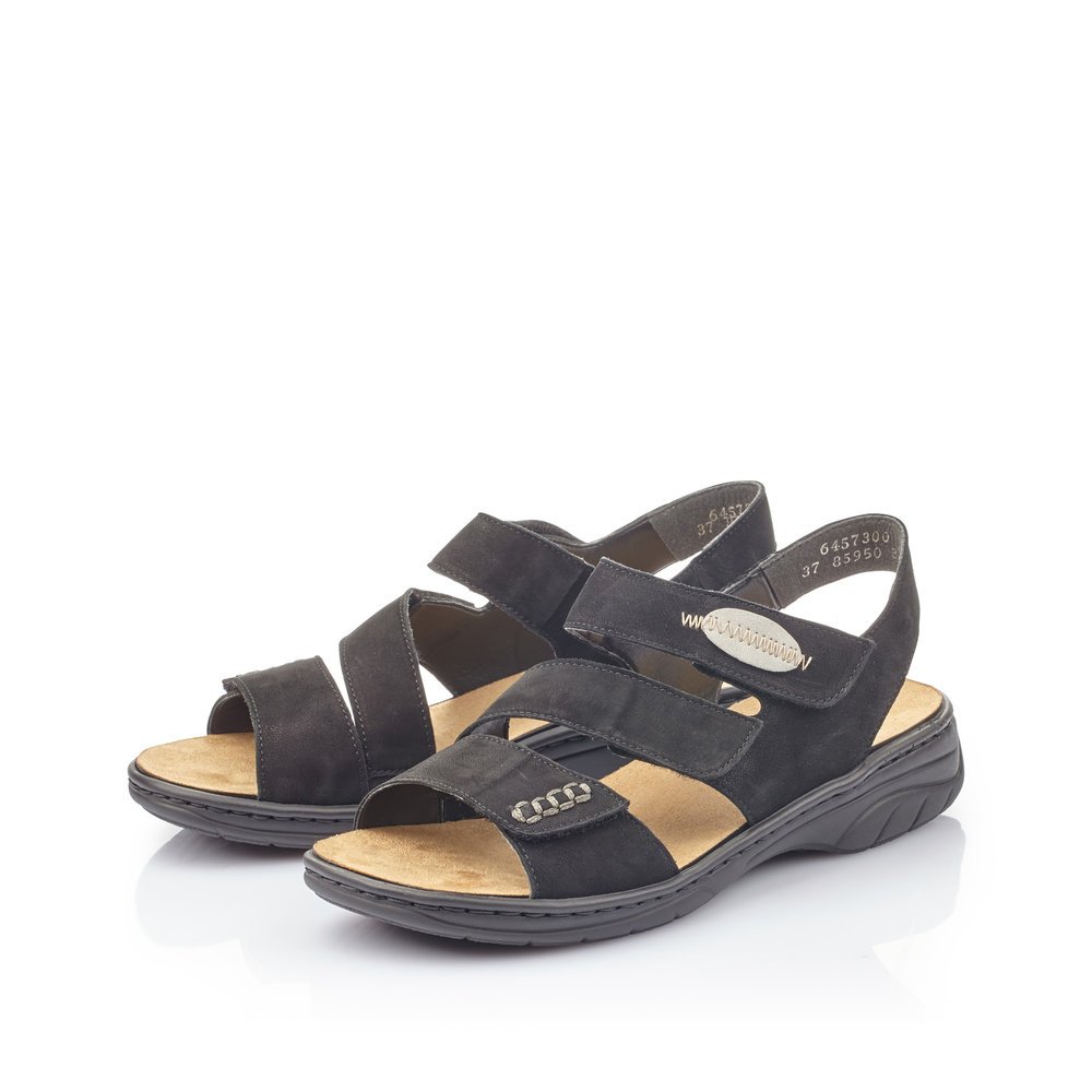 Jet black Rieker women´s strap sandals 64573-00 with a hook and loop fastener. Shoes laterally.