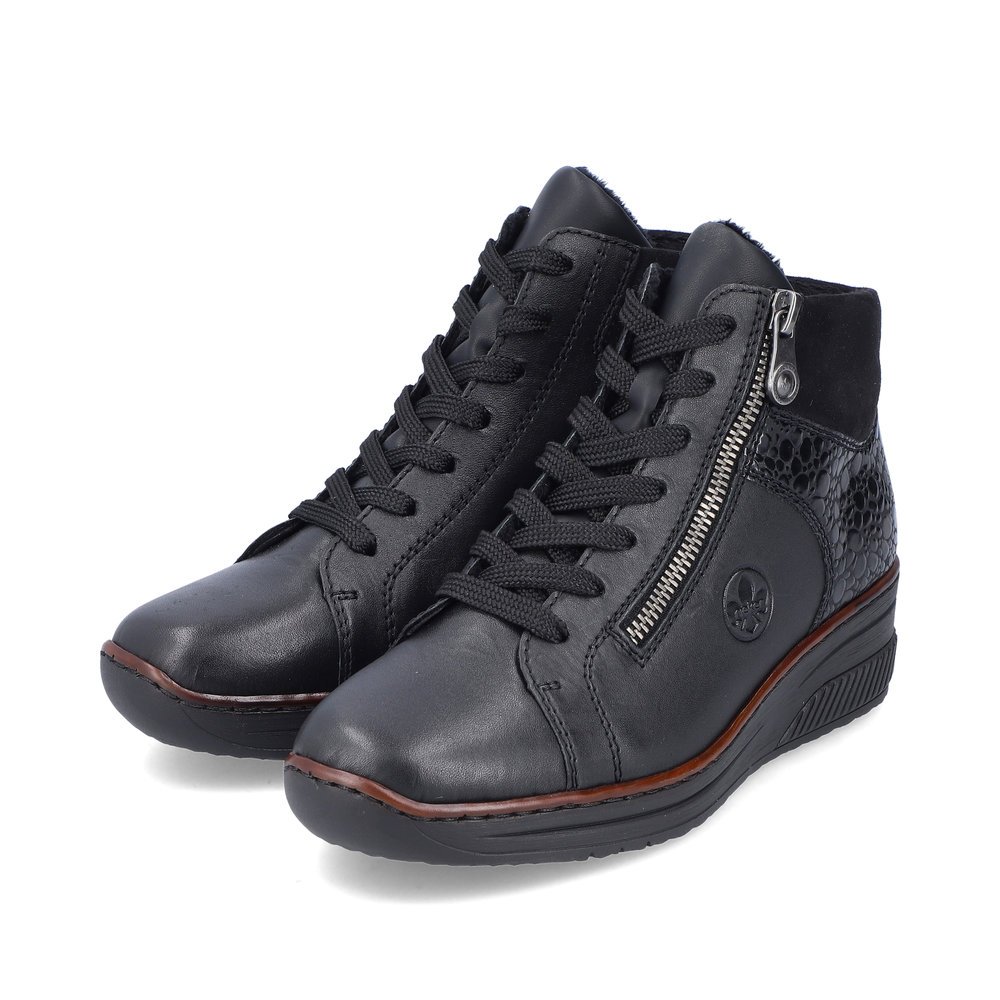 Glossy black Rieker women´s lace-up boots 48710-00 with light sole with wedge heel. Shoe laterally