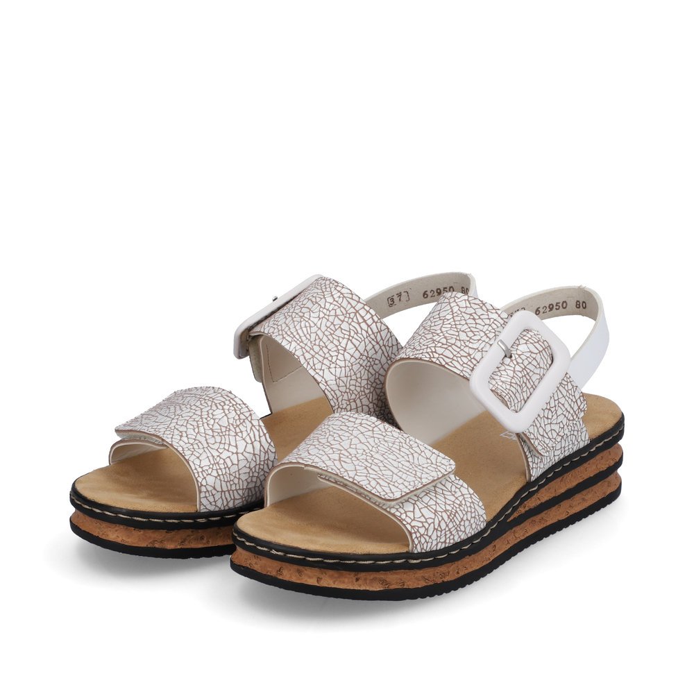 Ice white Rieker women´s wedge sandals 62950-80 with a hook and loop fastener. Shoes laterally.