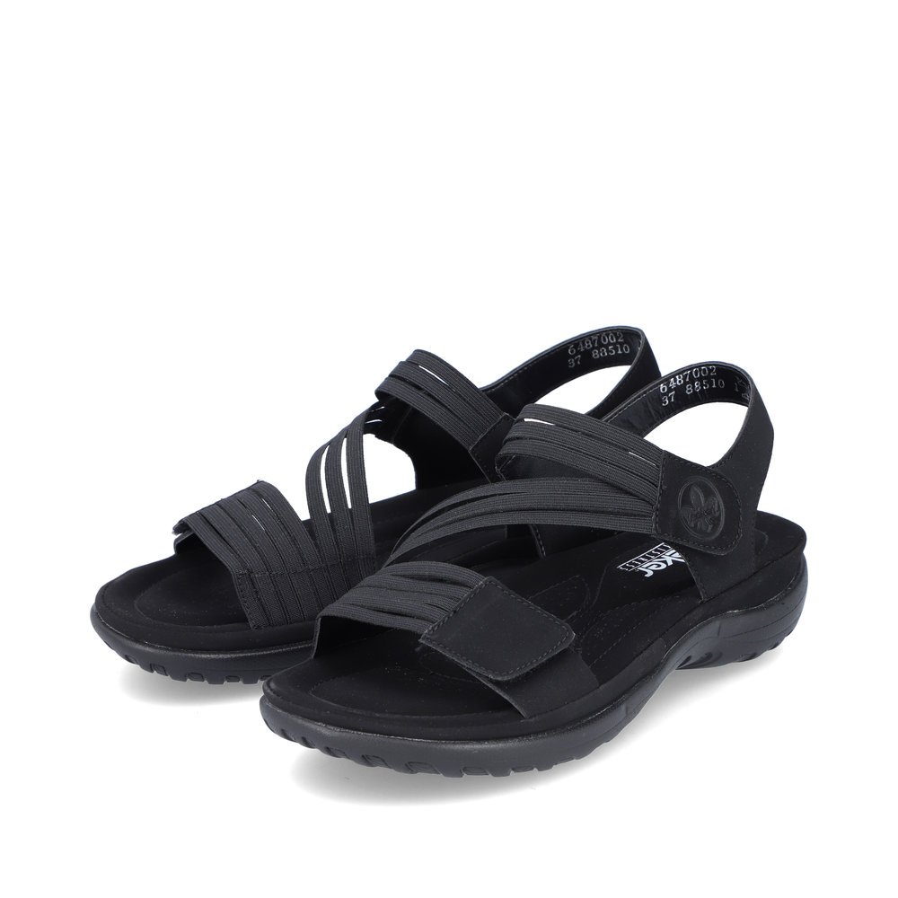 Black Rieker women´s strap sandals 64870-02 with a hook and loop fastener. Shoes laterally.