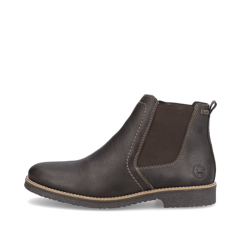 Black brown Rieker men´s Chelsea boots 33653-25 with zipper as well as profile sole. The outside of the shoe