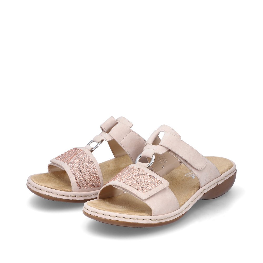 Pink Rieker women´s mules 65980-31 with a hook and loop fastener. Shoes laterally.