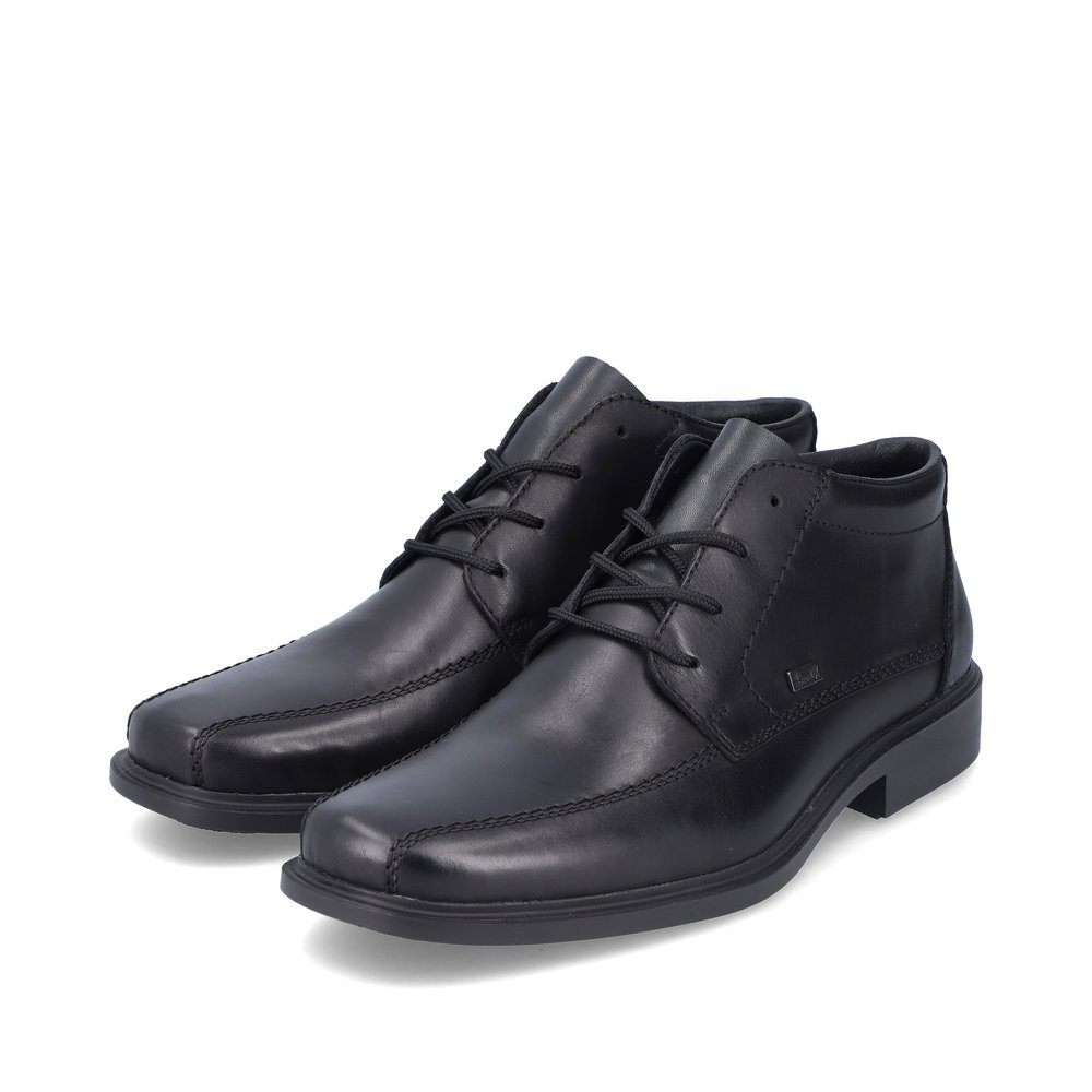 Glossy black Rieker men´s lace-up shoes B0011-00 with lacing as well as light sole. Shoe laterally