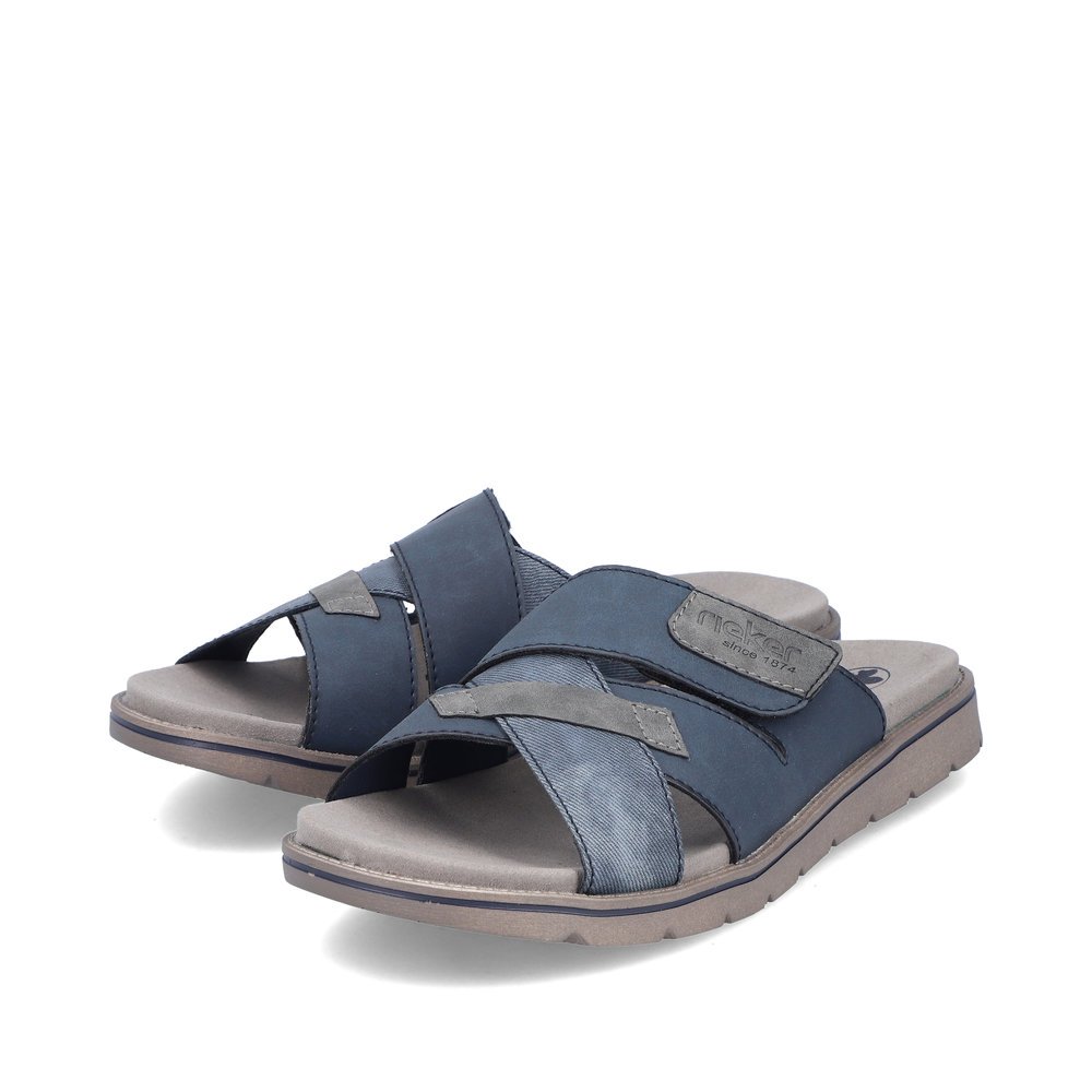 Slate blue Rieker men´s mules 24350-14 with a hook and loop fastener. Shoes laterally.