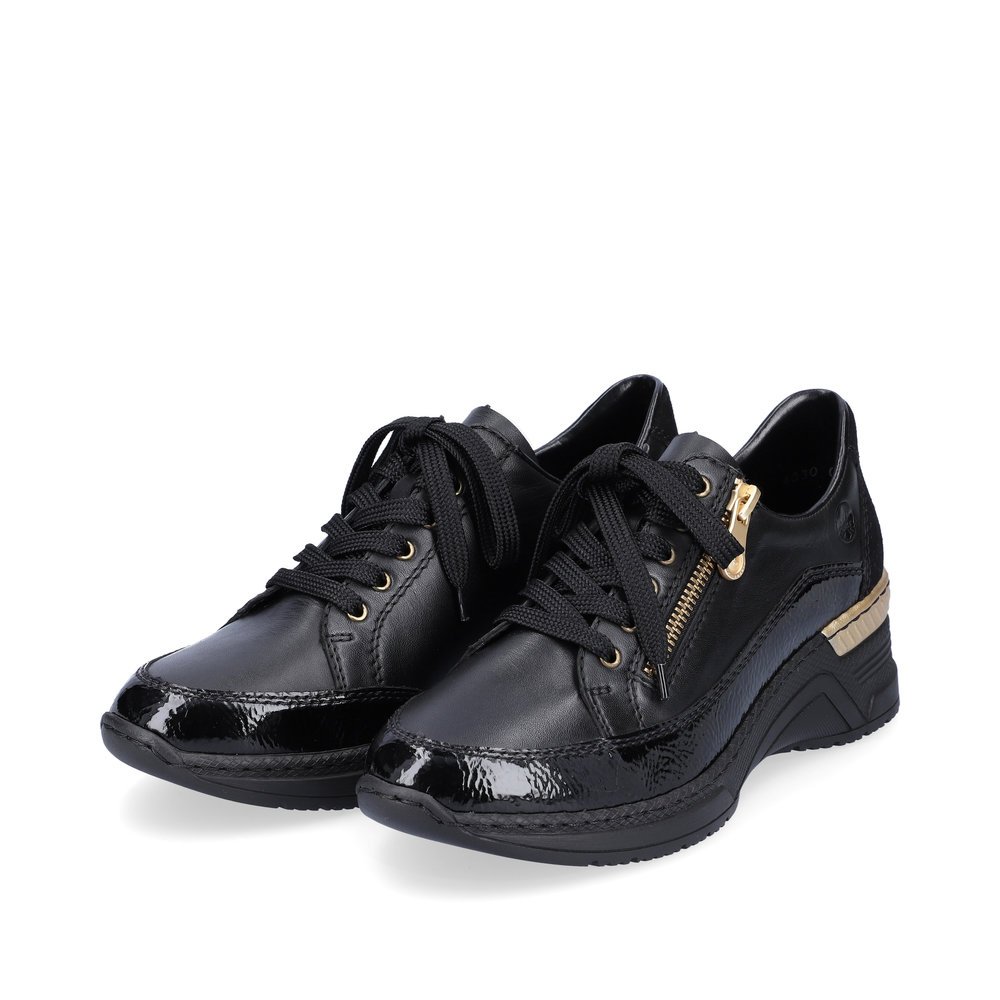 Jet black Rieker women´s sneakers N4330-00 with shock-absorbing platform sole. Shoe laterally