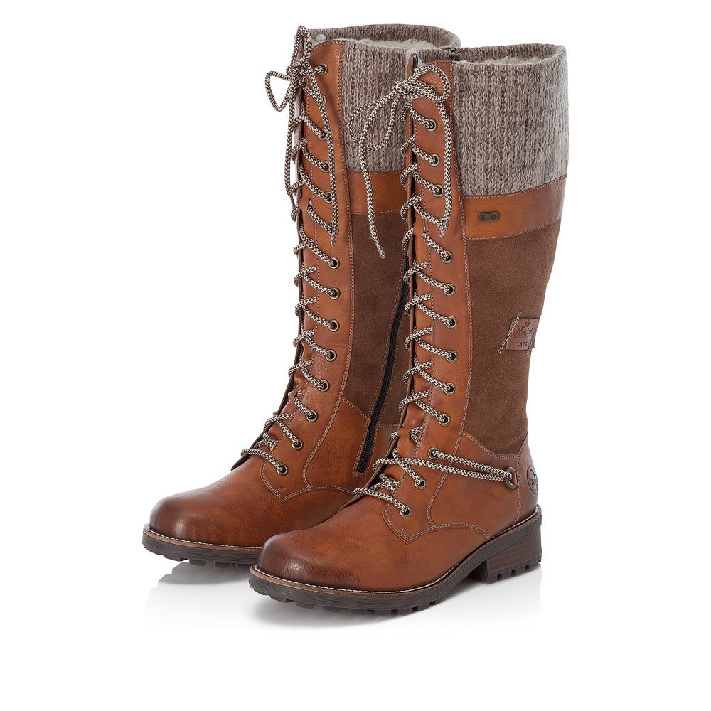 Caramel brown Rieker women´s high boots Z0442-24 with zipper as well as profile sole. Shoe laterally