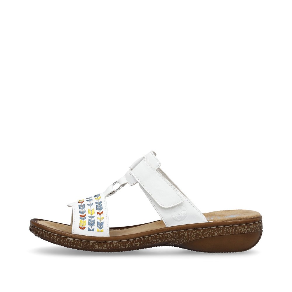 White Rieker women´s mules 62862-80 with a hook and loop fastener. Outside of the shoe.