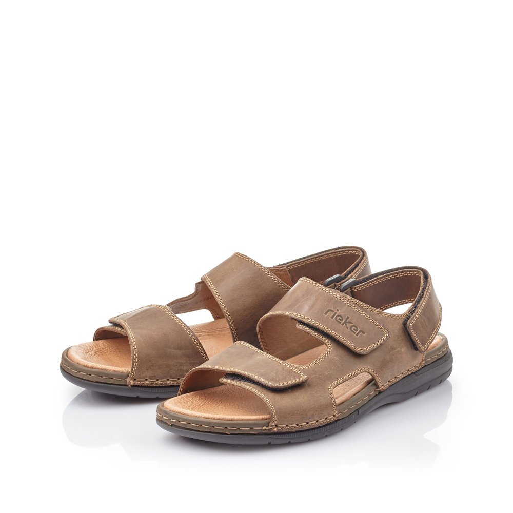 Brown Rieker men´s sandals 25558-25 with a hook and loop fastener. Shoes laterally.