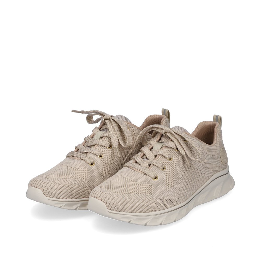 Beige Rieker women´s low-top sneakers 54022-80 with a flexible and ultra light sole. Shoes laterally.