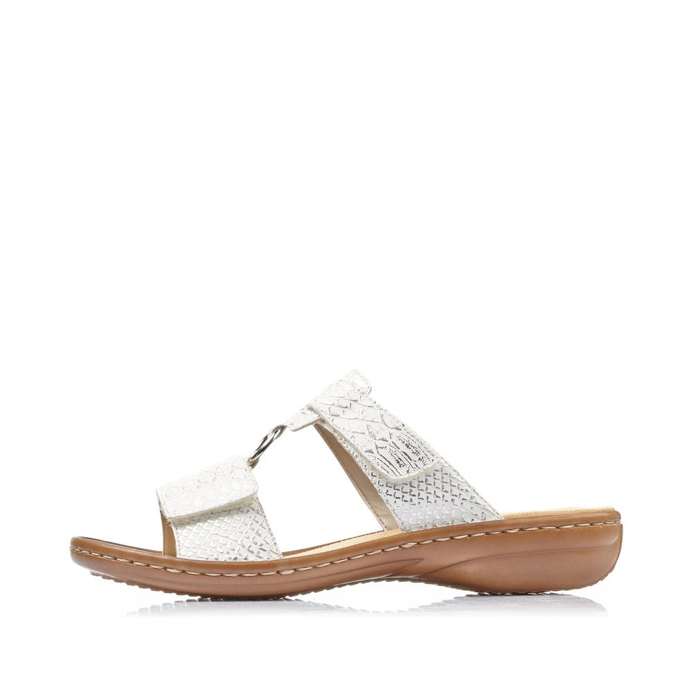 White Rieker women´s mules 608P9-80 with a hook and loop fastener. Outside of the shoe.