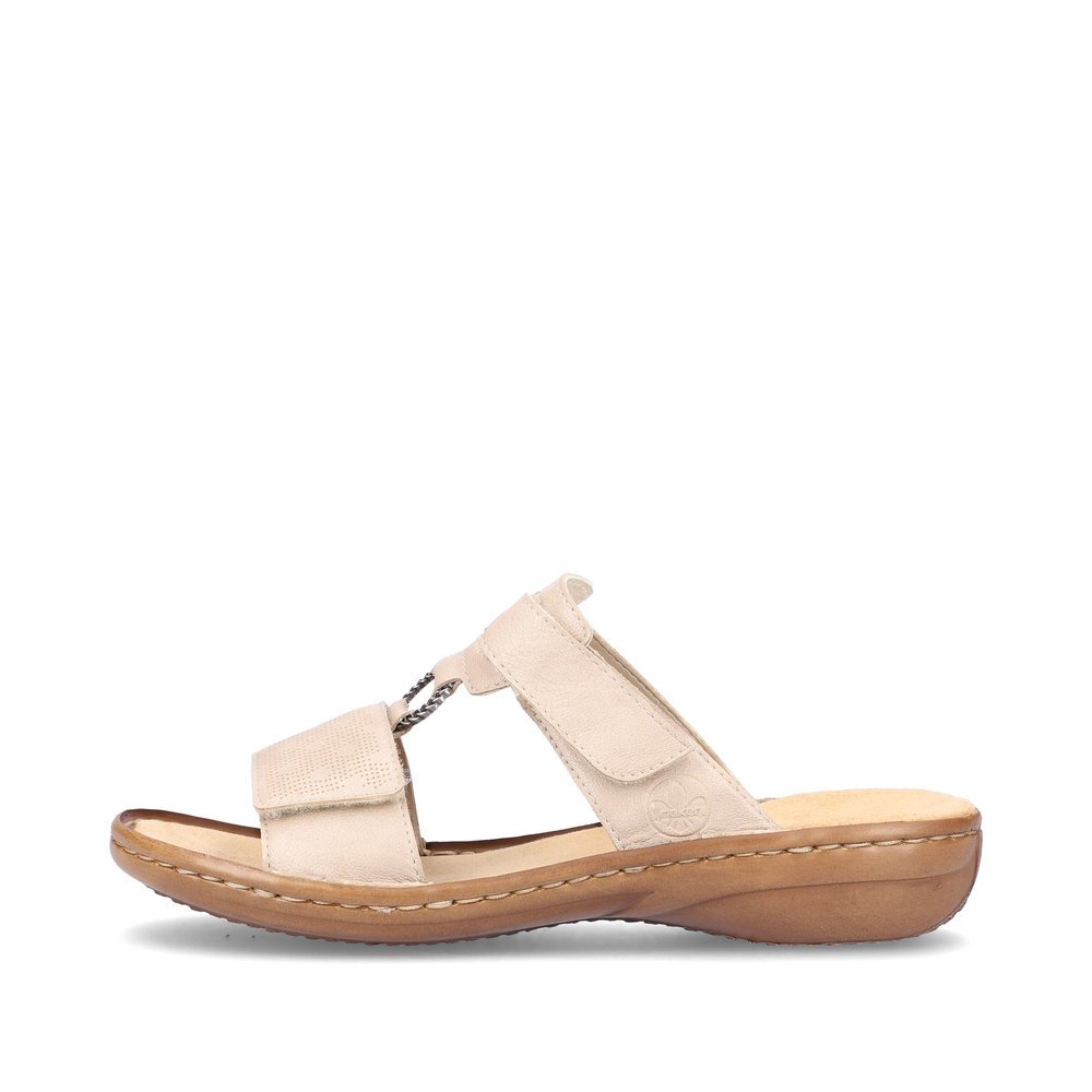 Clay beige Rieker women´s mules 60885-62 with a hook and loop fastener. Outside of the shoe.