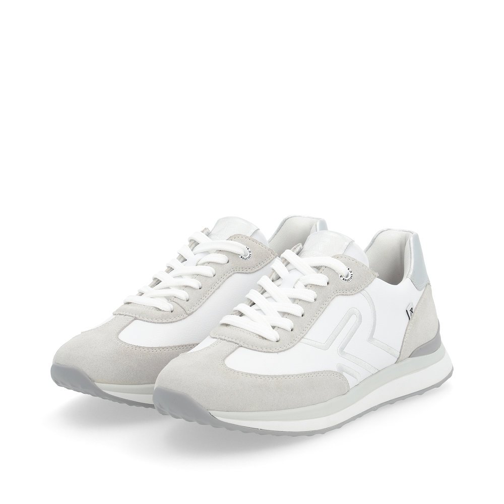 White Rieker women´s low-top sneakers 42509-80 with a flexible and super light sole. Shoes laterally.