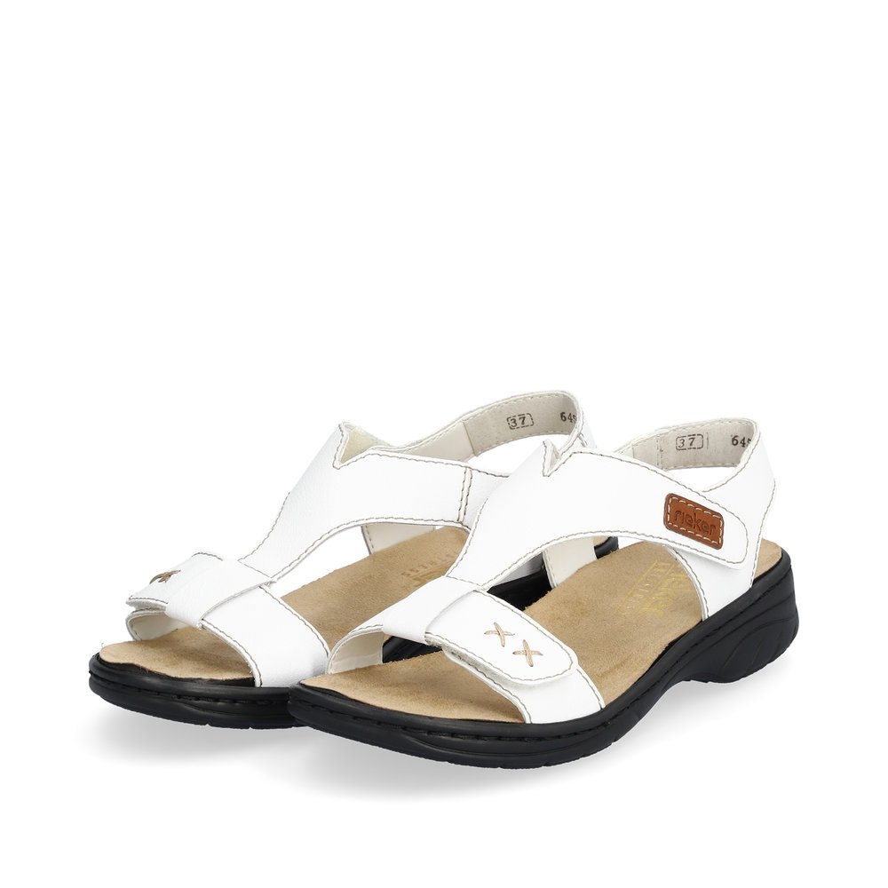 White Rieker women´s strap sandals 64577-80 with a hook and loop fastener. Shoes laterally.