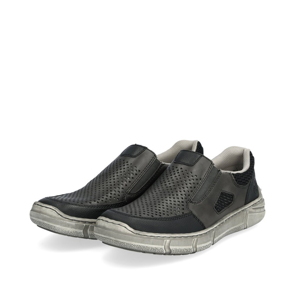 Grey Rieker men´s slippers 04051-40 with elastic insert as well as perforated look. Shoes laterally.