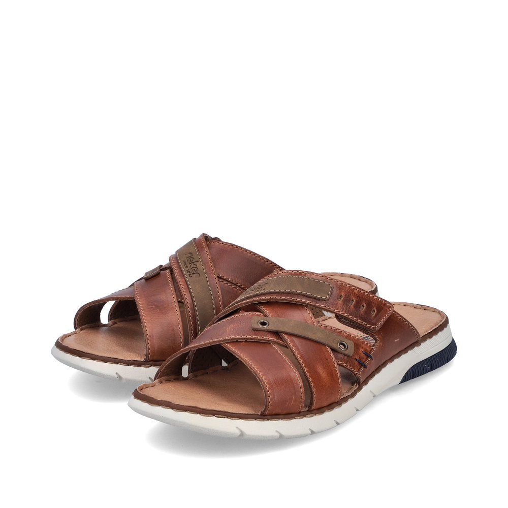 Maroon Rieker men´s mules 25292-24 with a hook and loop fastener. Shoes laterally.