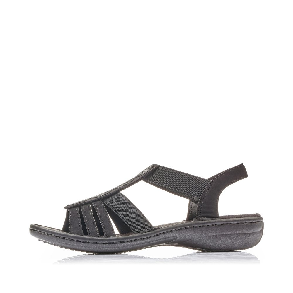 Jet black Rieker women´s strap sandals 60870-00 with an elastic insert. Outside of the shoe.