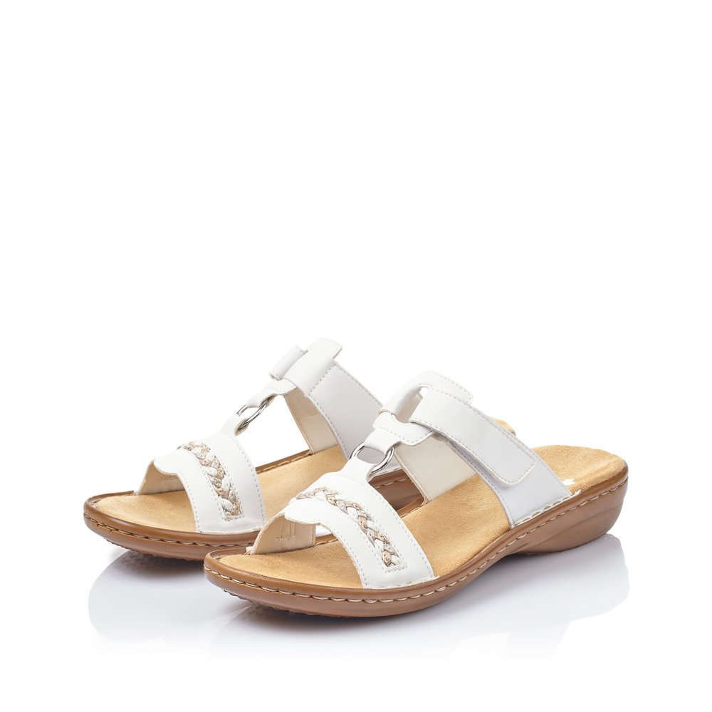 White Rieker women´s mules 60888-80 with a hook and loop fastener. Shoes laterally.