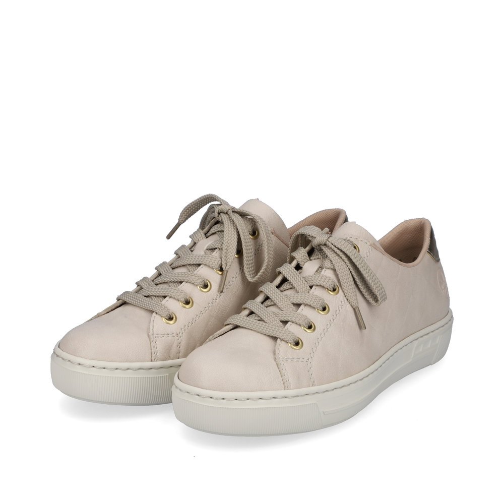 Light beige Rieker women´s low-top sneakers L9800-80 with lacing. Shoes laterally.