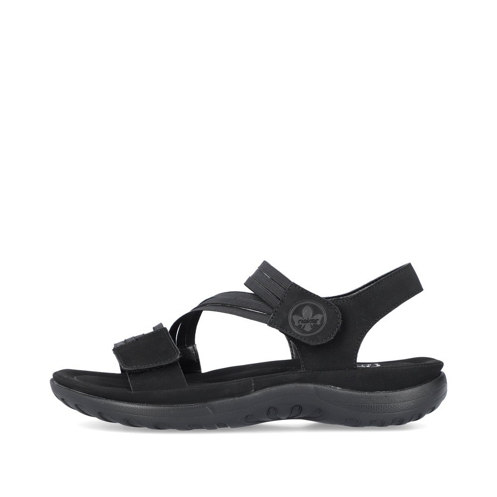 Black Rieker women´s strap sandals 64870-02 with a hook and loop fastener. Outside of the shoe.