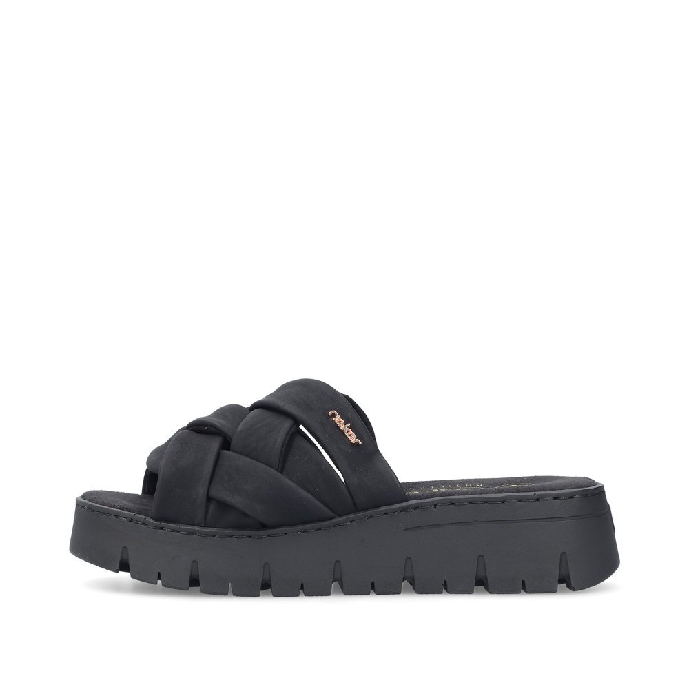 Black Rieker women´s mules V1008-00 with braided strap as well as slim fit E 1/2. Outside of the shoe.