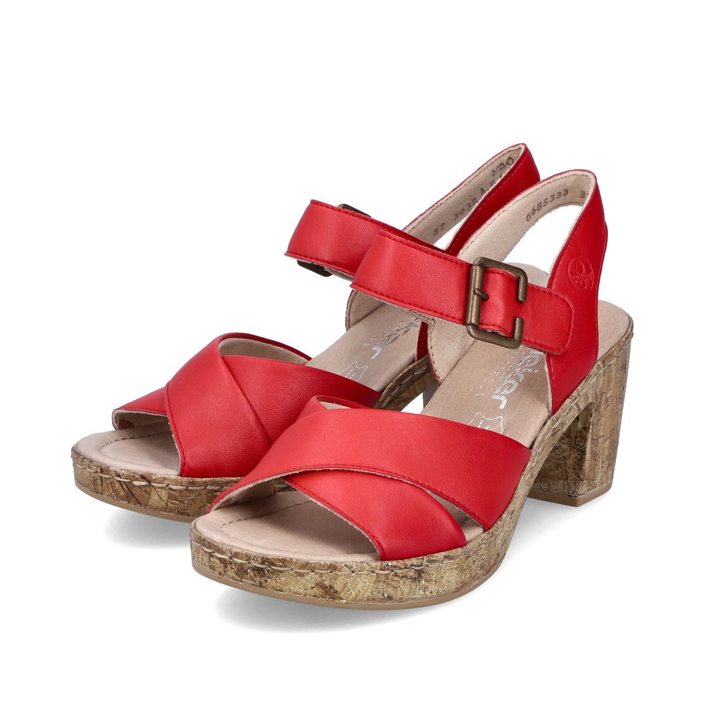 Red Rieker women´s strap sandals 66853-33 with a hook and loop fastener. Shoes laterally.