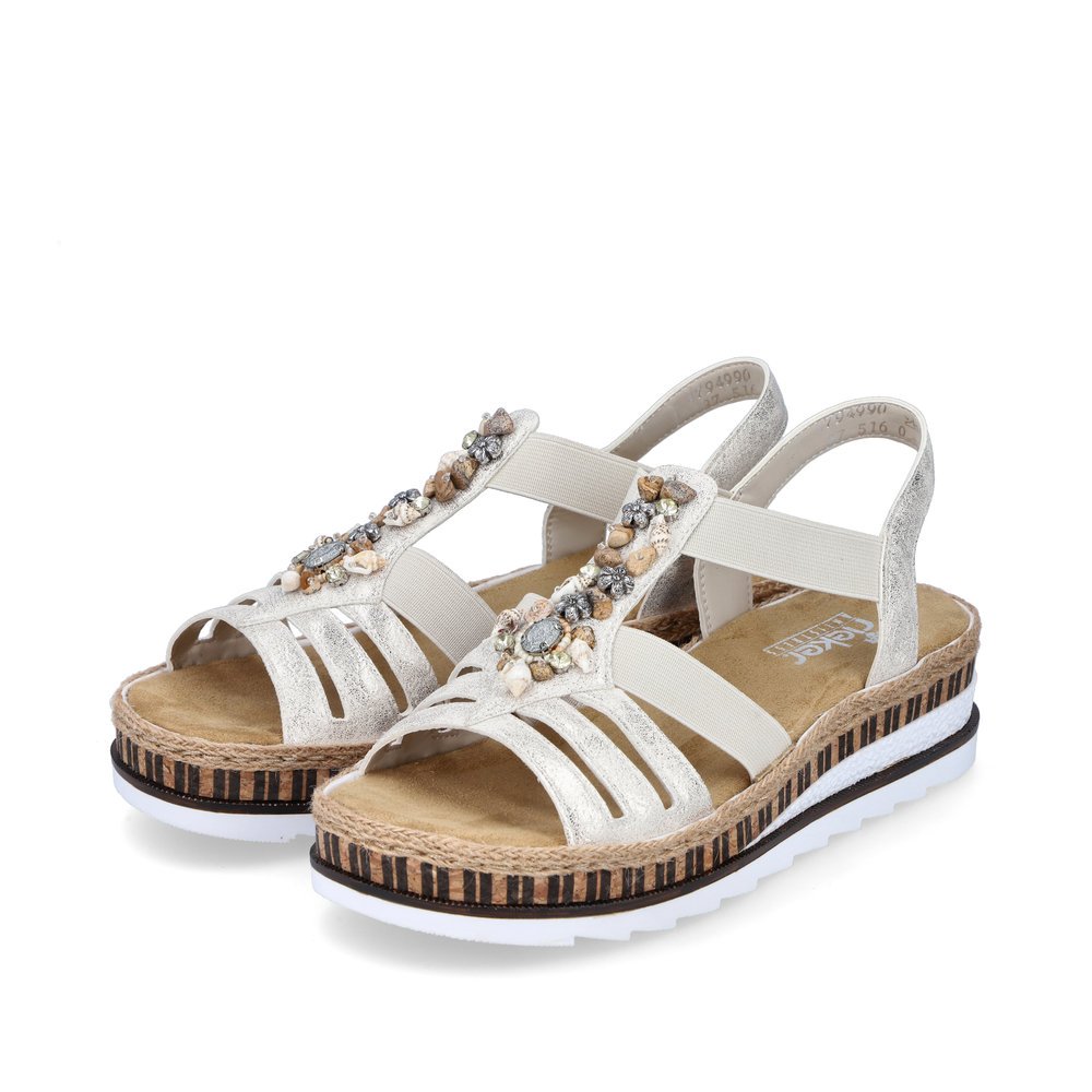 Beige Rieker women´s wedge sandals V7949-90 with an elastic insert. Shoes laterally.