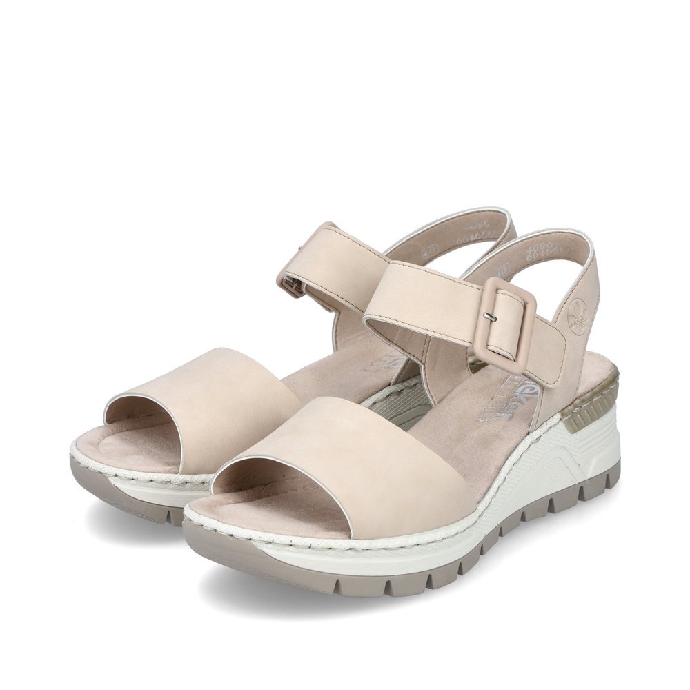 Beige Rieker women´s wedge sandals 66466-60 with a hook and loop fastener. Shoes laterally.